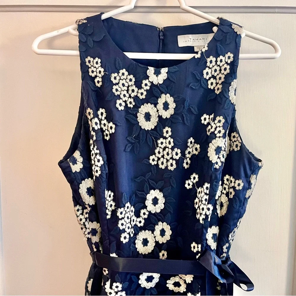 Tahari Elegant Sleeveless Dress with White Floral Embroidery over Deep Blue - Picture 3 of 14
